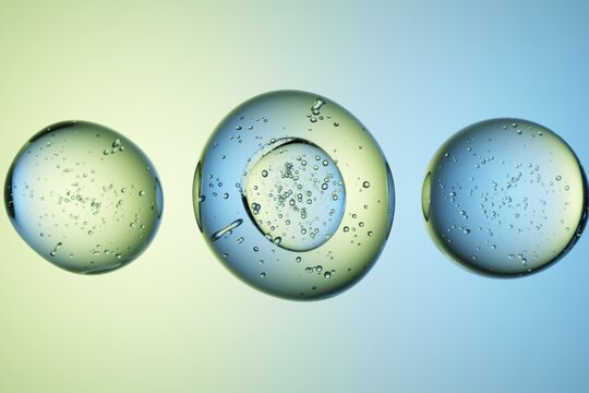 Transparent liquid bubbles with smaller bubbles, gradient background