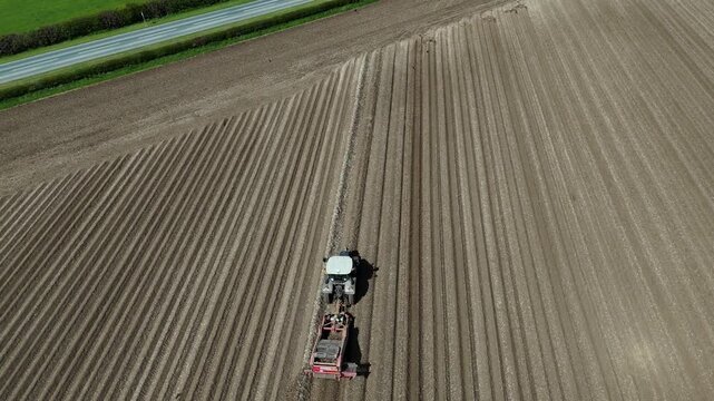 Aerial view farming potatoes bed former tractor plough