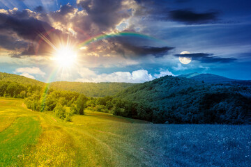 Fototapeta premium day meet night in beautiful countryside. epic view landscape in mountains on summer solstice. sun and moon in harmony over trail through the grassy field near forested rolling hills. rural scenery