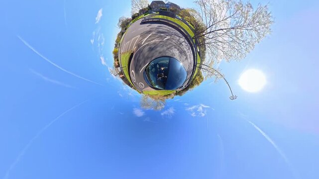 Ultra Wide Footage of British Urban City Streets During Car Drive. The Footage Was Captured with Car Roof Mounted 360 Camera During Sunny Day