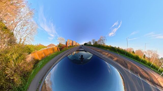 Ultra Wide Footage of British Urban City Streets During Car Drive. The Footage Was Captured with Car Roof Mounted 360 Camera During Sunny Day