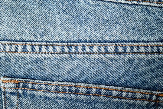Blue denim jeans texture with seams and stitching. Perfect for sale, discount,  promotion and advertising design.