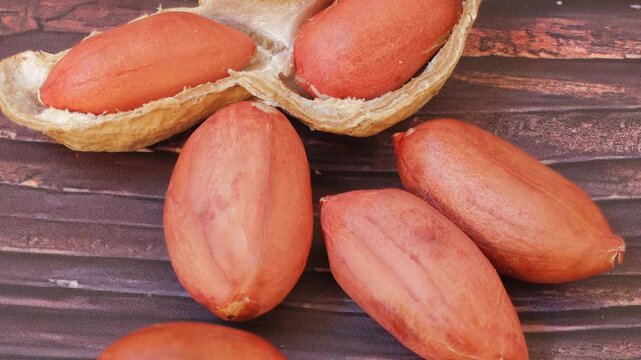 close up of peanuts on wooden background