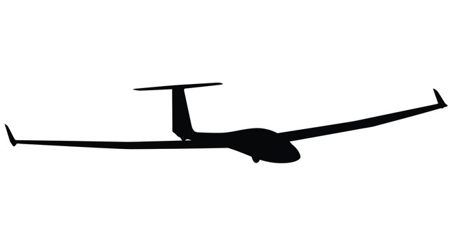 A sleek glider plane in flight captured as a striking silhouette