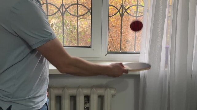 Juggling a ping pong ball with a paddle