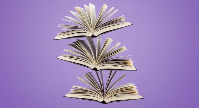 Three open books flying or levitating in a vertical stack against a solid purple background.