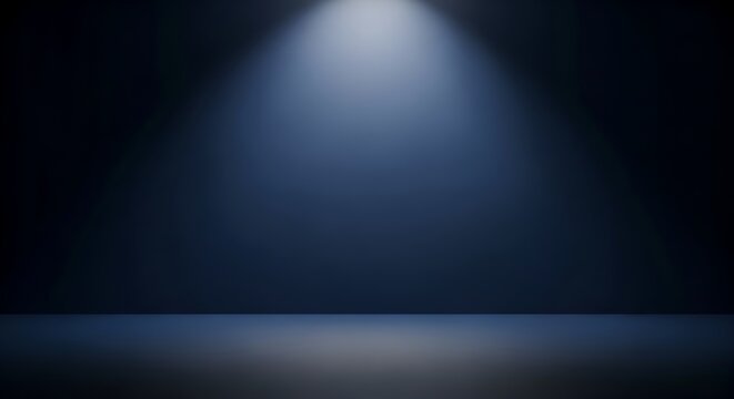 An empty stage with a single spotlight shining down, creating an aura of anticipation and focus. The space is a deep, dark blue, heightening the sense of drama and inviting attention