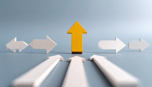 Yellow paper airplane diverging from arrows