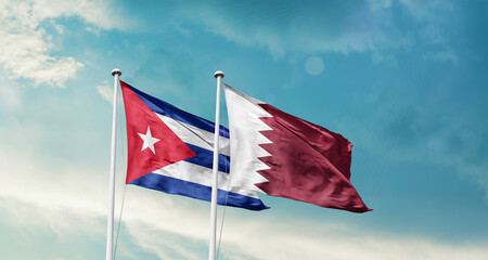 Fototapeta premium Cuba and Qatar friendship flags are waving in the sky. Two country flag for agreement or deal. Cuba Qatar national flag for commitment.