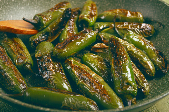 fried padron pepper, in a frying pan, with olive oil, and sea salt, homemade, no people.