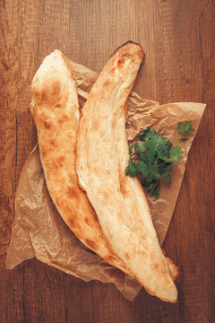 Georgian bread shotis, shotis puri, on a wooden table, top view,
