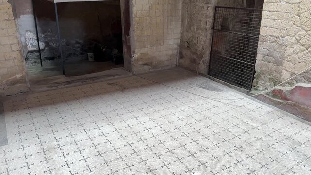 Preserved Room with White Mosaic Floor and Painted Walls in a Roman Villa of Herculaneum