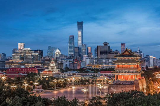 Beijing cityscape with Zhengyangmen gate and China Zun skyscraper at blue hour