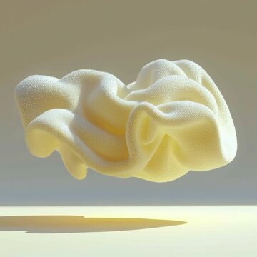 Soft fluffy white fabric shaped like a cloud floating smoothly above a bright yellow floor