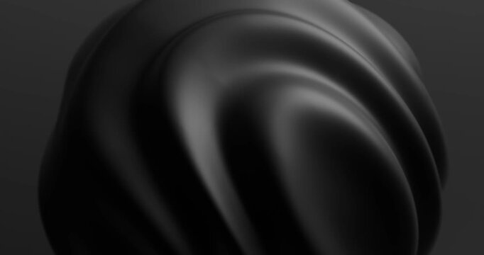 Abstract black sphere with curved ridges on dark background looping animation
