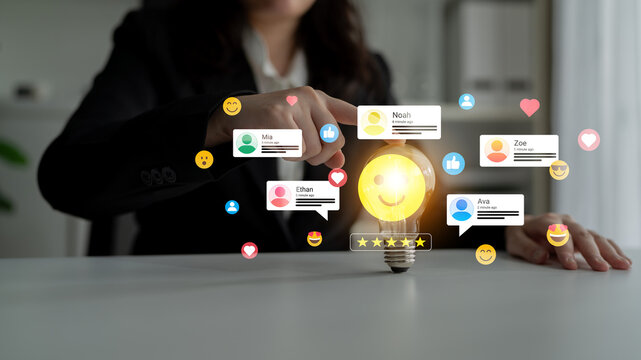 Business person interacts with a glowing light bulb surrounded by positive feedback icons, showcasing creativity and collaboration in a modern workspace. Ledger