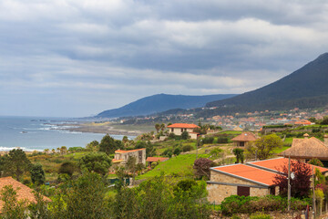 Fototapeta premium View of the Oia village on the coast of Atlantic ocean in the province of Pontevedra, in the autonomous community of Galicia, Spain. Portuguese Camino