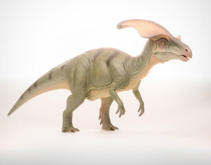 Fototapeta premium Studio shot of a realistic Parasaurolophus dinosaur model, emphasizing its distinctive tubular crest and green scales on a crisp white background, representing ancient prehistoric life