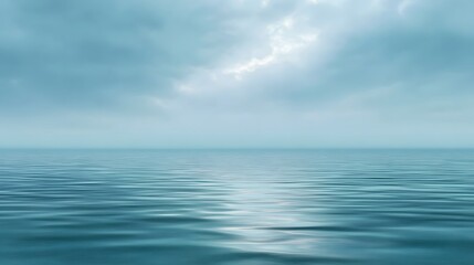 Fototapeta premium A vast and serene view capturing the gentle gradient where the open ocean meets a soft cloudy sky