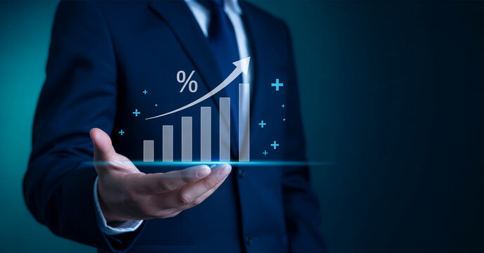 A businessman showing an exponential growth graph with percentage sign, symbolizing financial success.