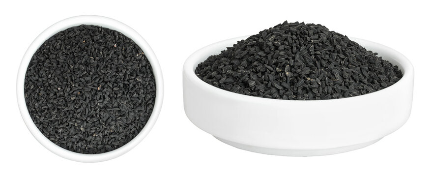 Nigella sativa or Black cumin in ceramic bowl isolated on white background. Top view. Flat lay.