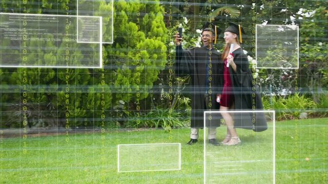 Two graduates walking lawn man raising phone causing digital overlays while posing for graduation