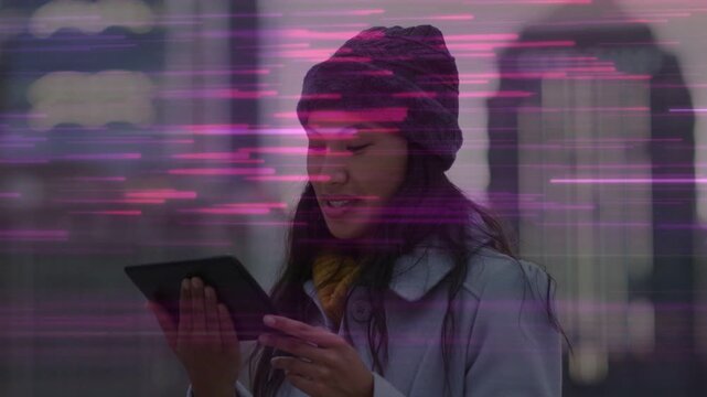 Woman with tablet glancing reacting to text laughing kissing pink-purple streaks sweeping tech