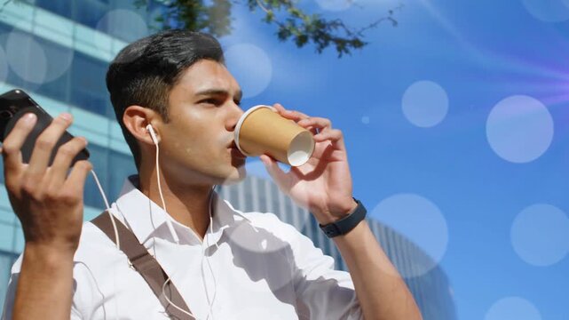 Man taking call on phone, sipping coffee heading to office, animated lens flare sweeping around him