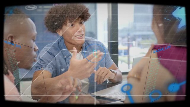 Central male pointing toward laptop and presenting in business meeting, HUD overlay animating data