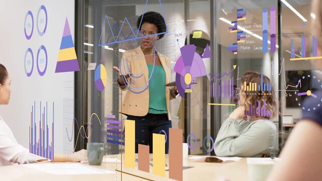 Lead woman tapping tablet and gesturing in business meeting, activating charts and guiding choices