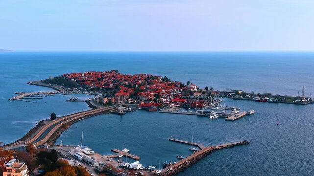 Aerial view of Old Nessebar town and harbor. Panoramic shot of the historic old town of Nessebar on a peninsula with harbor and sea.