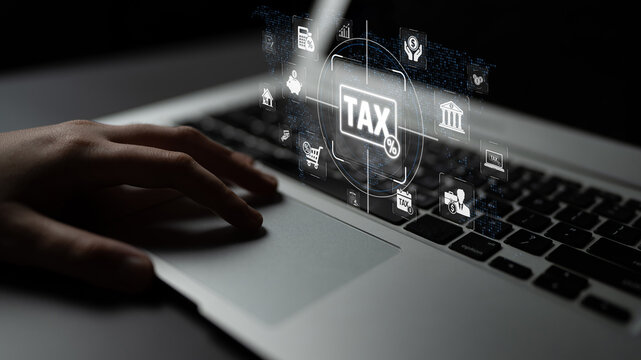 Hand on Laptop with Tax Symbols and Digital Icons Representing Financial Management, Online Filing, and Economic Concepts in a Modern Workspace Sigmoid