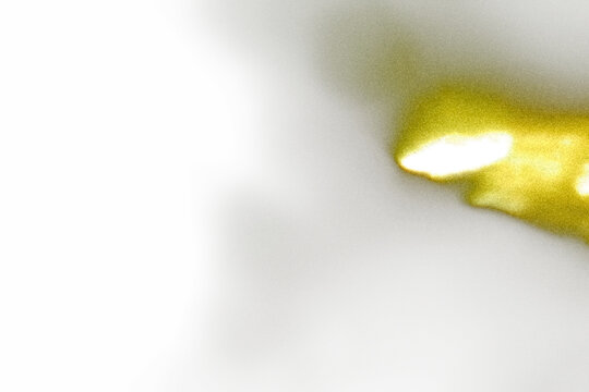 Grainy film texture overlay with golden yellow light leak in corner fading to white, soft overexposed film burn glow effect, retro analog grain noise, transparent PNG