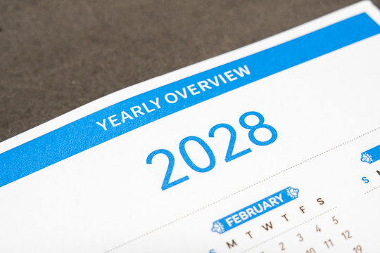 A close-up view of a 2028 yearly overview calendar page showcasing February, illustrating a structured layout of dates and weekdays for planning purposes.