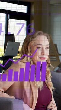 Vertical video: Businesswoman on sofa watching data analysis driving purple charts overlaying frame