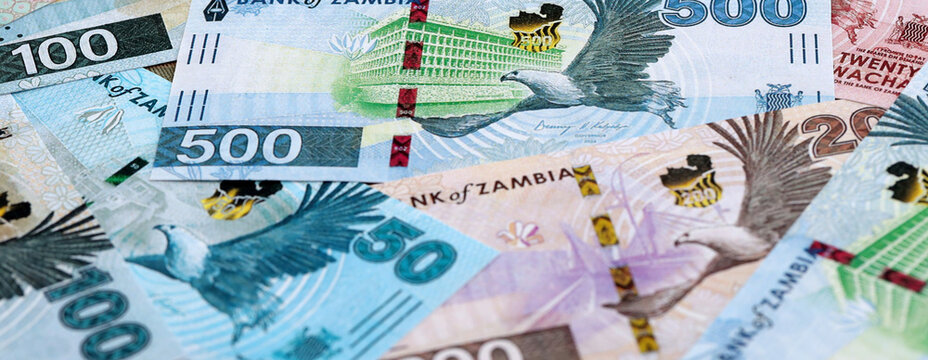 Zambian kwacha money banknotes pile on table. Zambia bills of ZMW currency close up