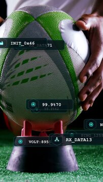 Vertical video: Athlete placing football on tee as cleat entering, HUD updating metrics for kick