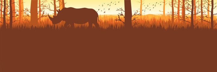 Flat design calm autumn woodland banner with rhino silhouette © FahrizalNurMuhammad