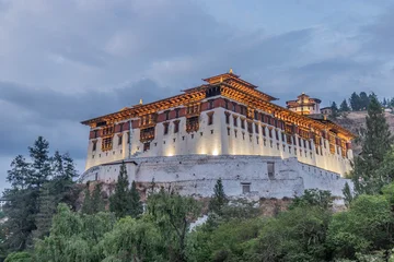 Fototapeten Khaki Evening view of  Rinpung Dzong, Buddhist monastery and fortress in Paro, Bhutan  © Matyas Rehak