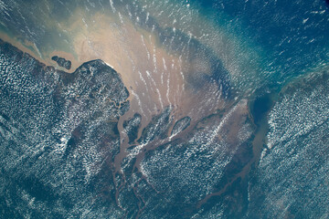 Aerial photo of the Amazon River meeting the Atlantic Ocean © Tsado