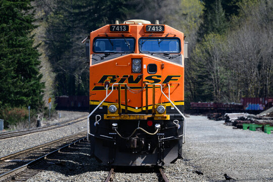 Skykomish, WA, USA - April 17, 2026; BNSF orange freight locomotive with swoosh logo front view