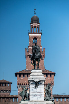 Filarete Tower of the Sforza Castle in Milan and the equestrian monument of Giuseppe Garibaldi in the foreground. Italy