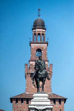 Filarete Tower of the Sforza Castle in Milan and the equestrian monument of Giuseppe Garibaldi in the foreground. Italy