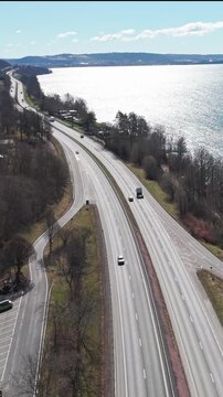 Vertical Aerial view of E4 highway running along V&auml;ttern lake in J&ouml;nk&ouml;ping, Sweden