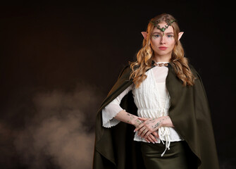 Naklejka premium Beautiful elf girl on black background with smoke, space for text