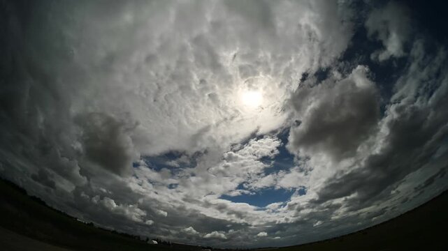 Time-lapse of dramatic summer storm clouds building and evolving across a wide angle sky view creating powerful atmospheric motion and weather intensity