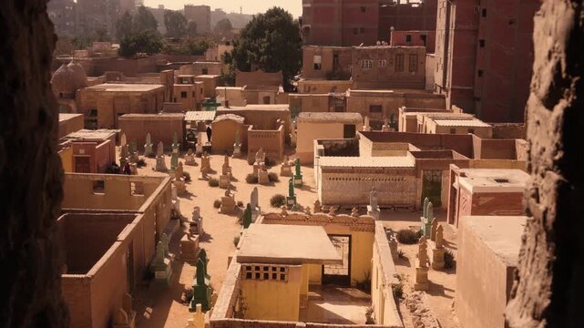 View of Cairo City of the Dead from abandoned building window. Shot from a broken window of an abandoned building overlooking a section of Cairo&rsquo;s City of the Dead.