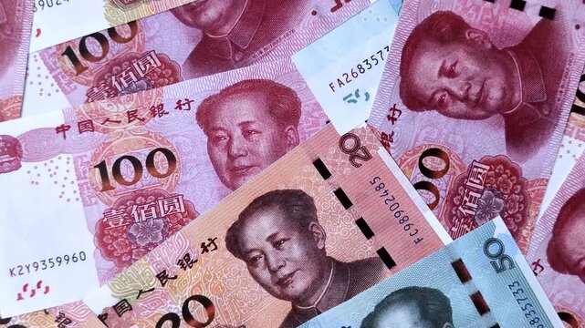 Chinese paper money, yuans in various denominations. China money as a business background for your design