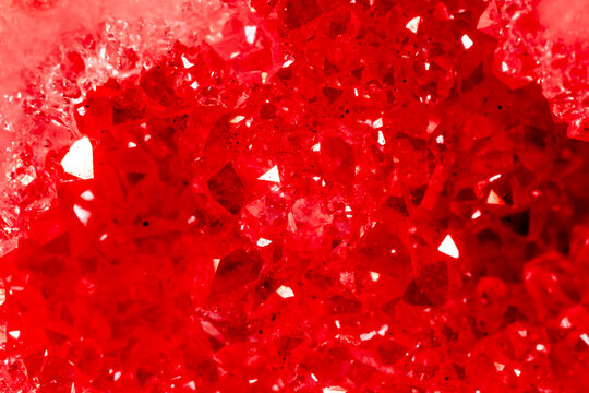 Amethyst red crystals. Gems. Mineral crystals in the natural environment. Texture of precious and semiprecious stones. Seamless background with copy space colored shiny surface of precious stones.