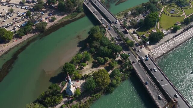 Aerial View of Bridge Traffic Over Ganges River with Lord Shiva Statue and Riverside Park in Haridwar
